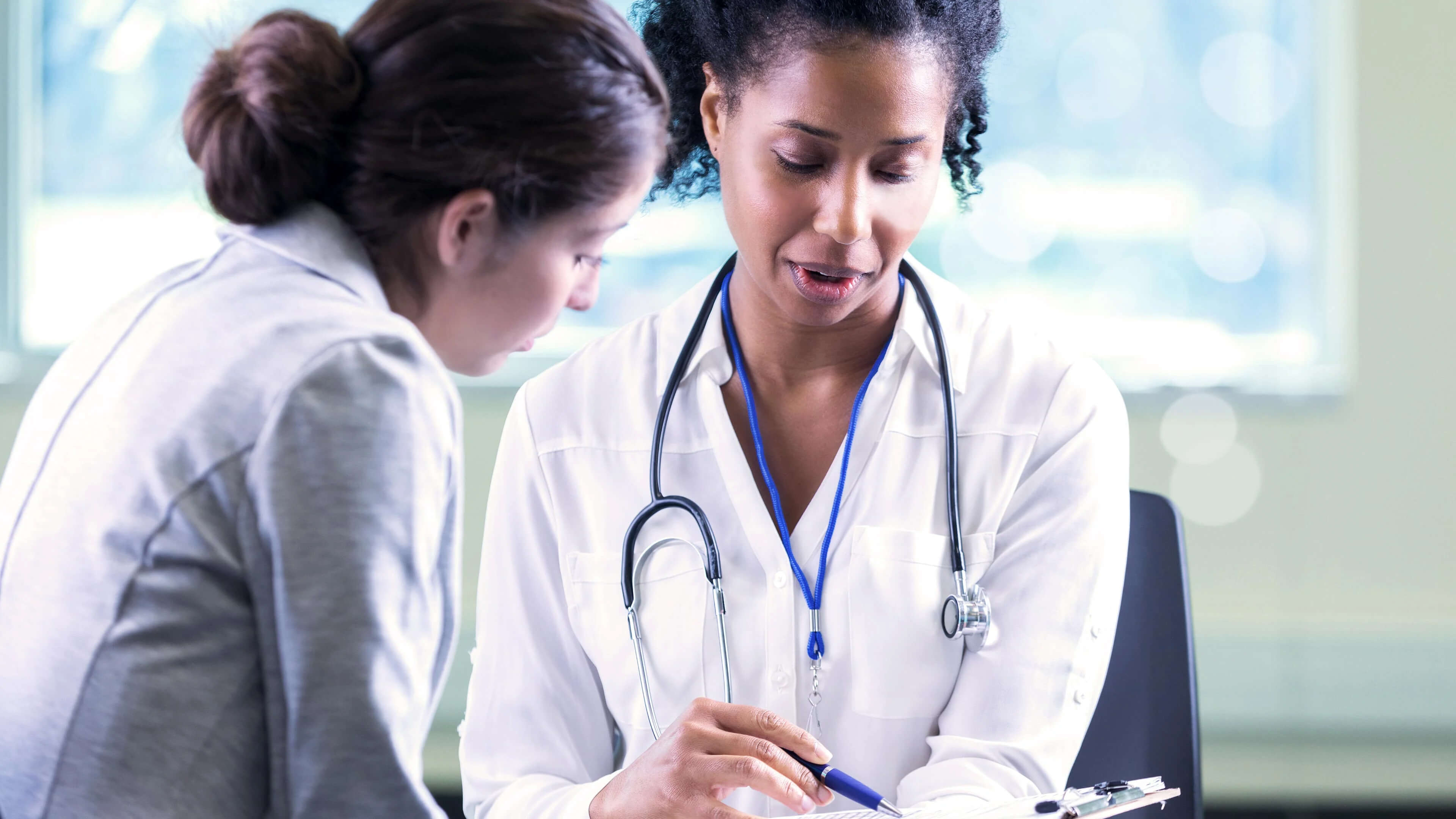 An Image of a healthcare professional helping a diabetes patient