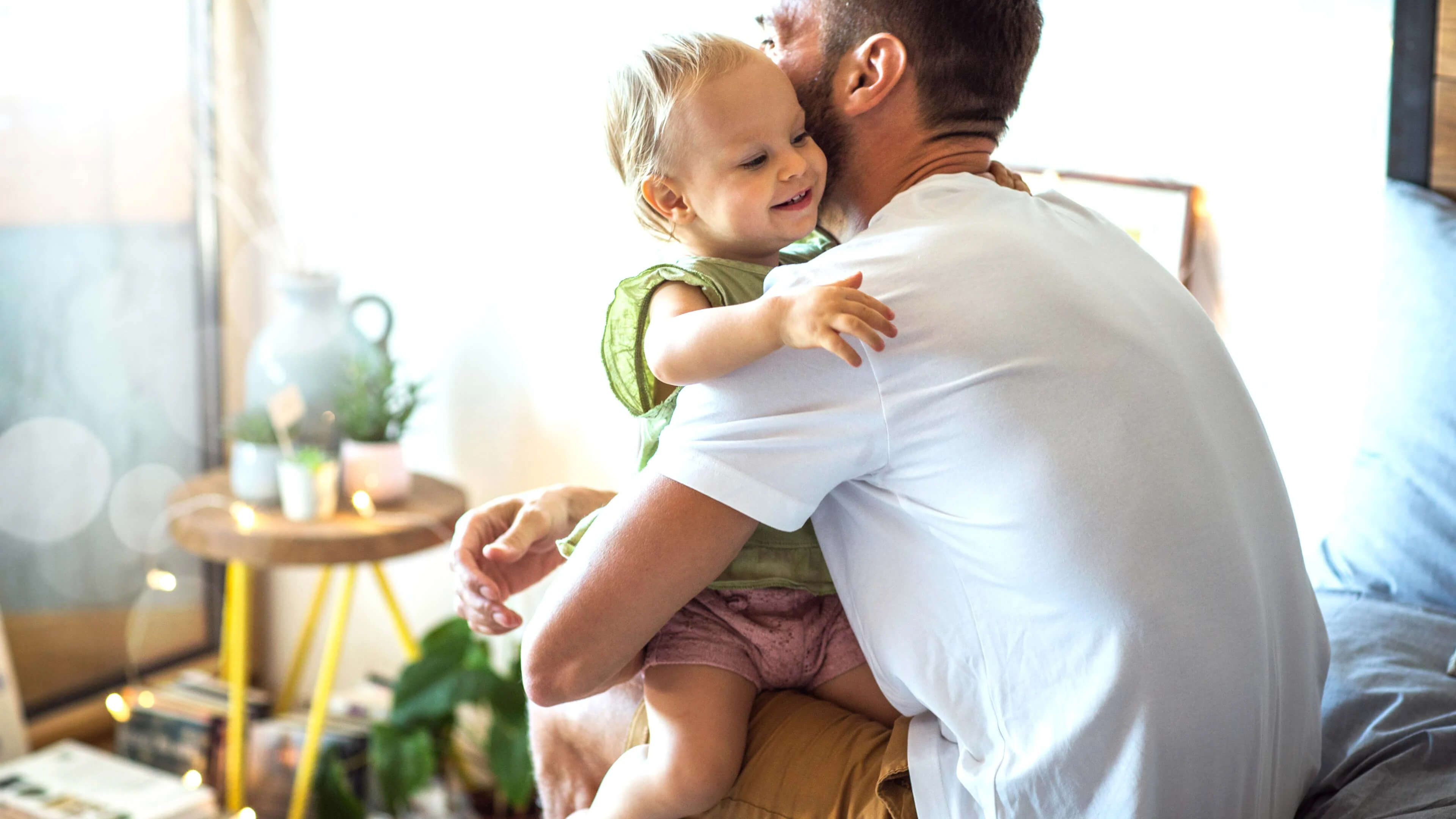 An image of a father hugging his child