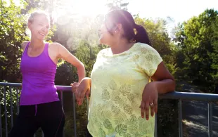 An Image of a couple of women standing next to each other